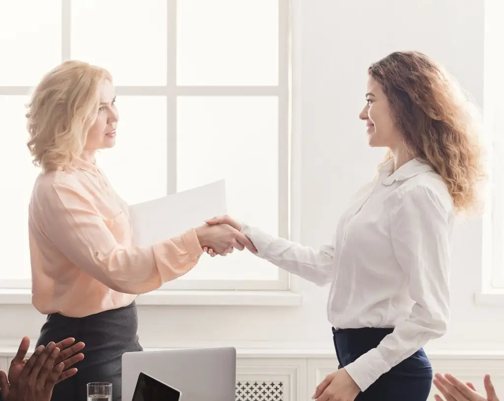 Employee receiving congratulations for a job well done.