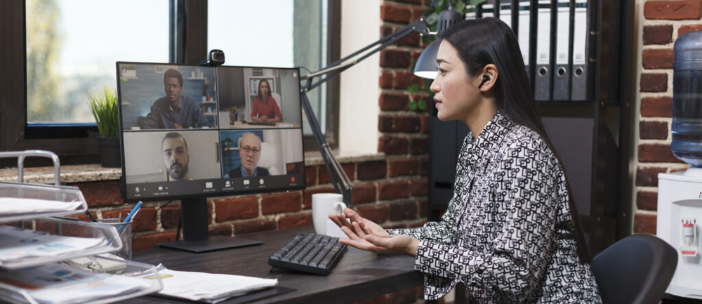 A TruCentive employee at their home office on a virtual meeting.