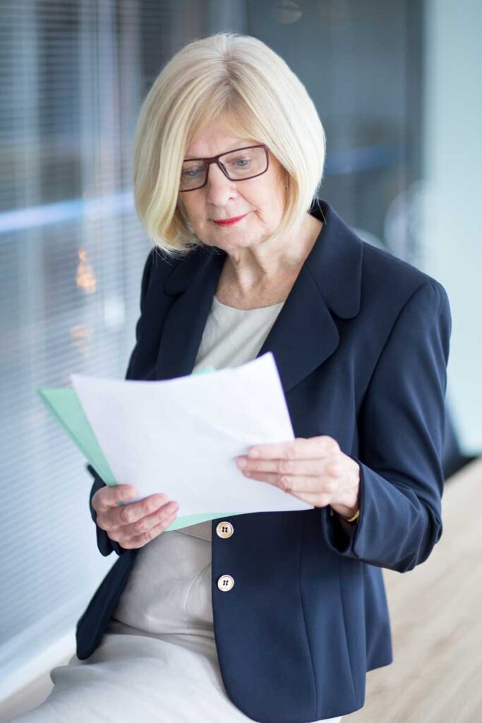business woman reading research report